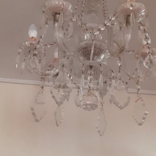 Vintage lighting set with heavy crystal seven-light chandelier and two matching two-light sconces