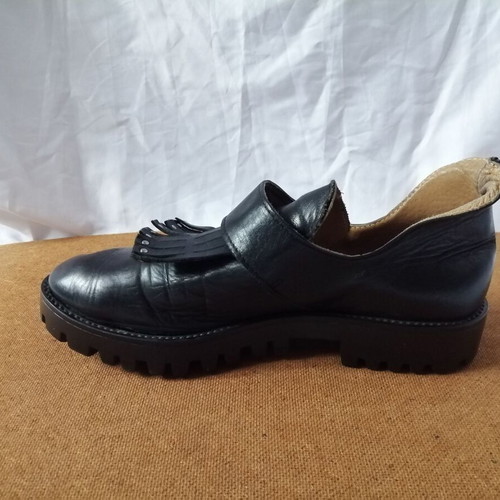 Women's black leather loafers with tassels and snap buttons, size 37