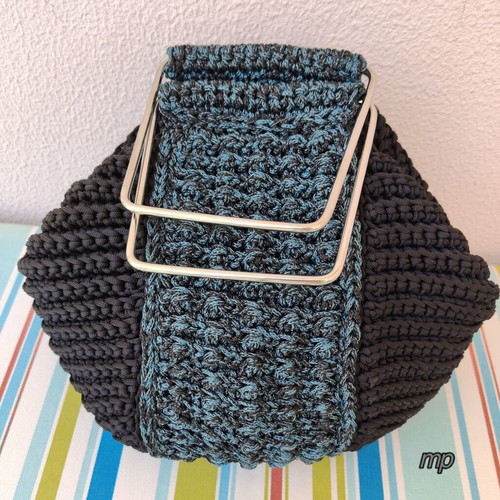 Handmade knitted bag with metal handles and inner lining