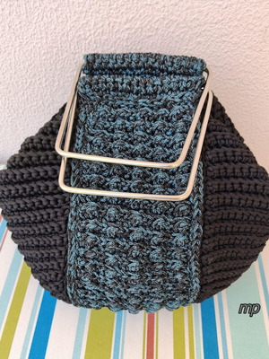 Handmade knitted bag with metal handles and inner lining