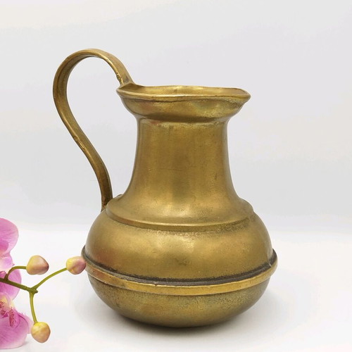 Old bronze pitcher used, vintage vase