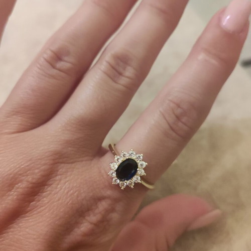 Women's rosetta ring new, gold color with blue oval stone and zircons