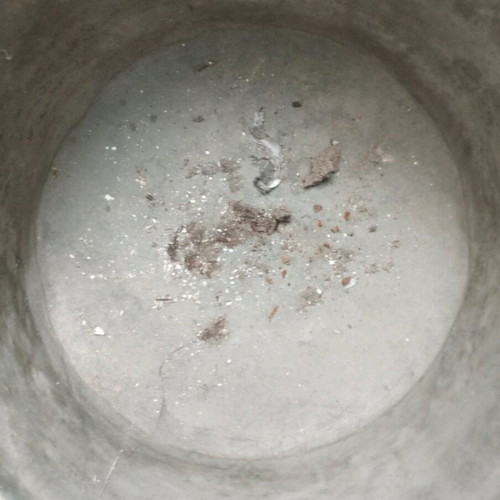 Large handmade bronze cauldron used with iron handles