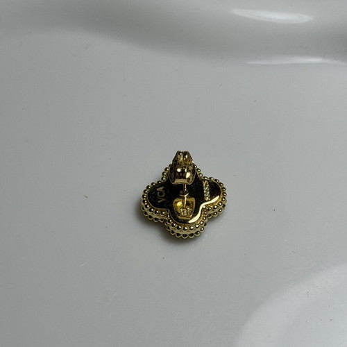 Steel earring black and gold, like new, single piece
