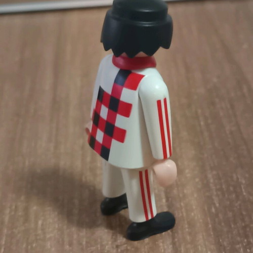 Playmobil figure with white outfit and checkered pattern like new