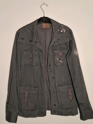 Khaki jacket used with decorative details and waist drawstring