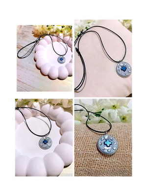 Handmade necklace with stainless steel iridescent silver motif and blue hematite cross