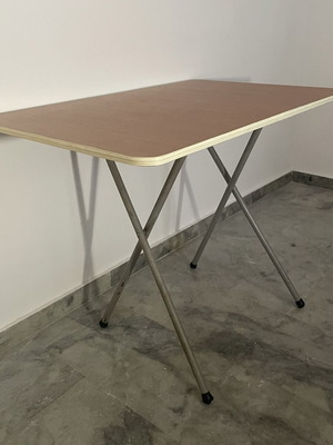 Folding table used with metal base and brown melamine top