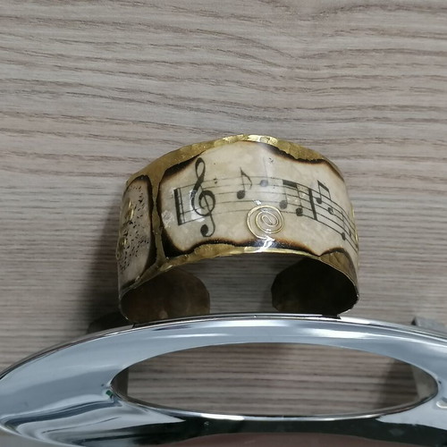 Handmade hammered copper bracelet with musical note design like new