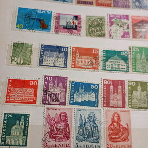 Two stamp albums with stamps from around the world