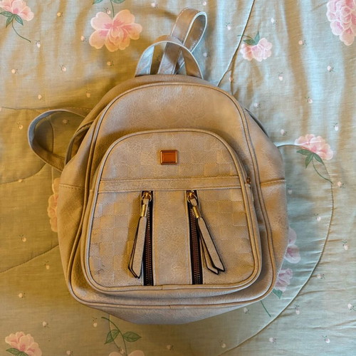 Women's backpack used in light gray color