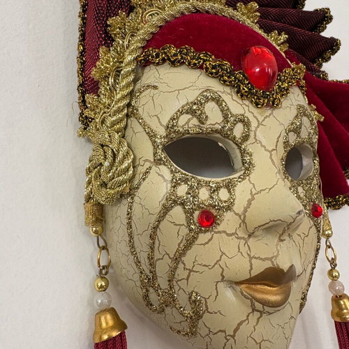 Decorative mask with red velvet details and gold embellishments, like new