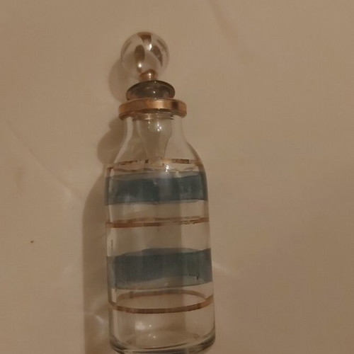 Vintage small glass bottle used with blue and gold stripes