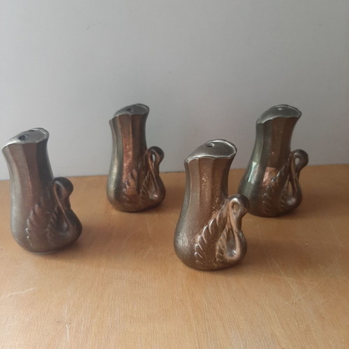 Vintage salt and pepper set with swan designs, used, 4 pieces