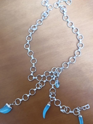 Craft supplies used, broken plastic chain with 3 turquoise horns and letter b or β