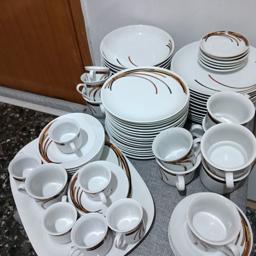 Porcelain set like new, 17 fruit plates, 12 dinner plates, 12 soup plates, 6 tea cups, 6 Greek coffee cups, 6 Nescafe cups, oval platter