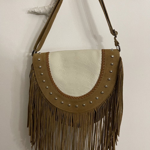 Suede leather shoulder bag used with fringes and silver details