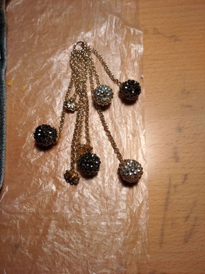 Hanging accessory with chains and balls with rhinestones