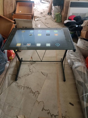 Metal desk with glass tablet screen used