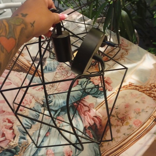 Two rhombic metal ceiling lights