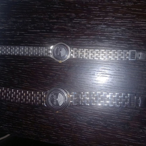 Akashi men's and women's watch set like new, gold and silver
