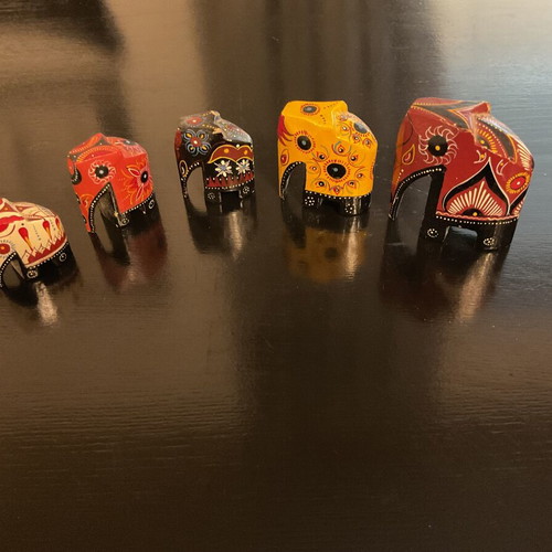Decorative family of five wooden hand-painted elephants like new
