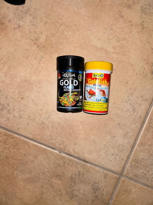 Fish food new, full containers