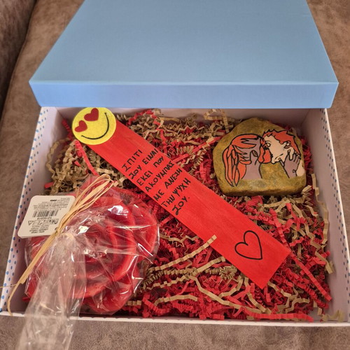 Giftbox for a romantic couple with rose candle, bookmark and stone