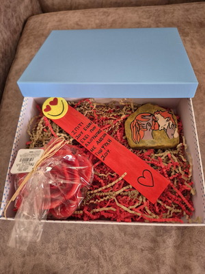 Giftbox for a romantic couple with rose candle, bookmark and stone