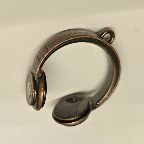 Beats headphones pendant or keychain like new, gold color