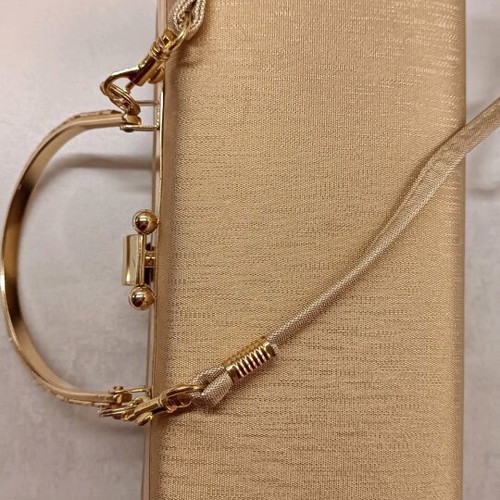 Gold evening handbag like new with missing rhinestone