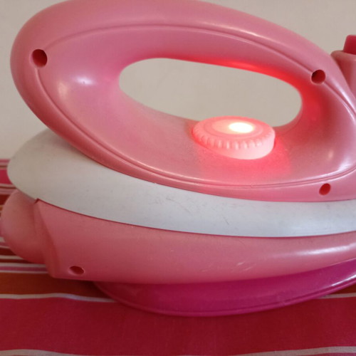 Toy ironing board with light-up iron that plays music like new