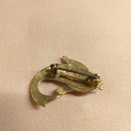 Dolphin pin used, silver and gold color