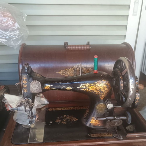 Singer portable sewing machine used, collectible