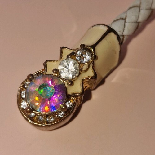 Bracelet made of white leather with gold clasps used