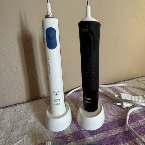 Oral B Braun electric toothbrushes with chargers and spare head