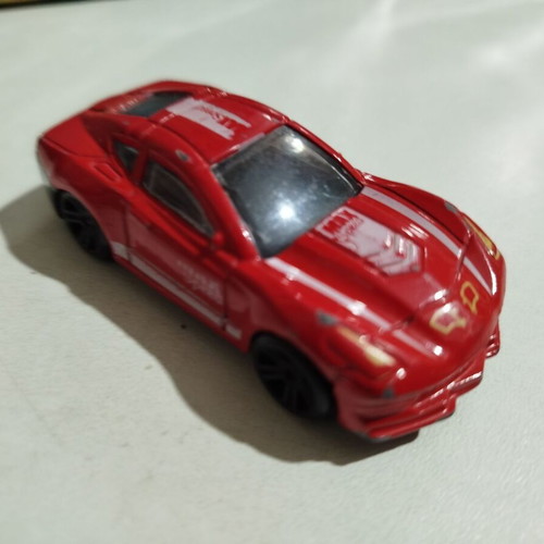 Red toy car used in very good condition
