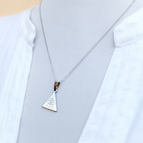 Minimal handmade steel chain necklace with a triangle pendant featuring a carved eye