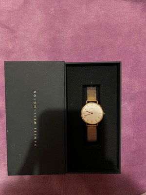 Daniel Wellington women's watch used with gold bracelet