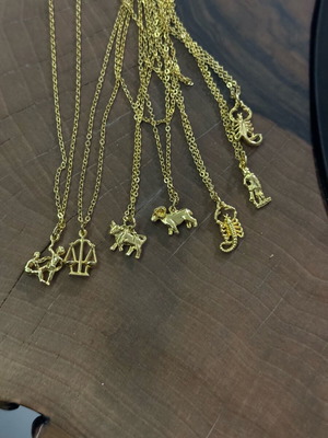 Zodiac necklaces set like new, pack of 14 gold-colored pieces