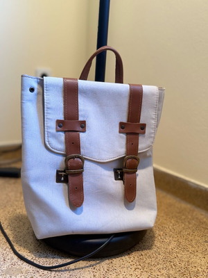 Blue backpack with brown leather details like new