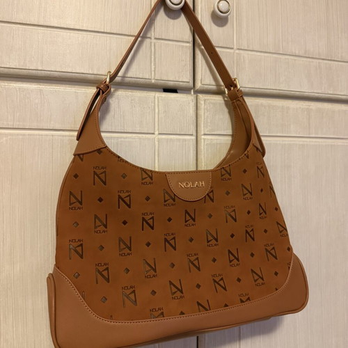 Nolah shoulder bag in camel and brown with monogram design