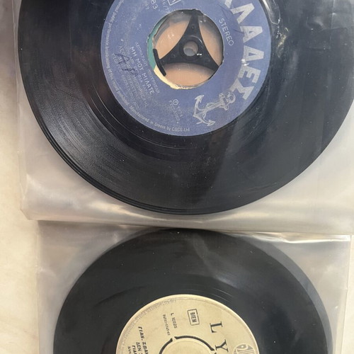 Vinyl 45 rpm records used, two cases with over fifty laiko and rembetika