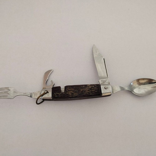 Vintage pocket knife with integrated fork and spoon, used