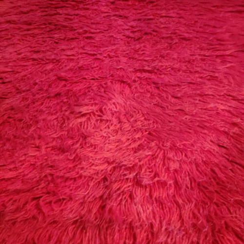Red flokati rug used, traditional wool, approx. 230x140 cm