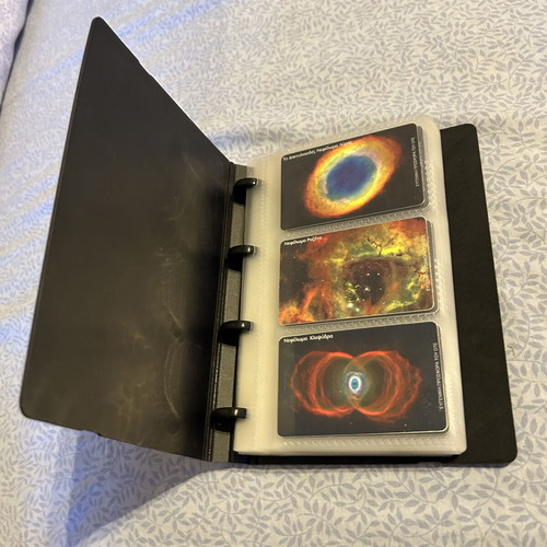 Phone card album with 32 universe-themed cards and 50 extra sleeves like new