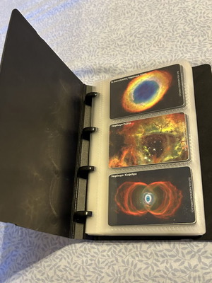 Phone card album with 32 universe-themed cards and 50 extra sleeves like new