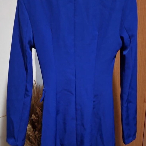 Blue dress like new with shoulder pads and decorative pocket