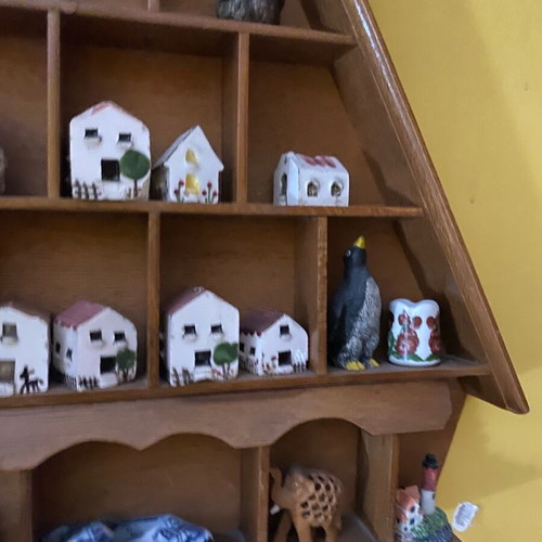 Decorative wall shelf with miniature collection case used
