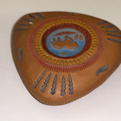 Vintage decorative clay paperweight with ethnic embossed designs, like new